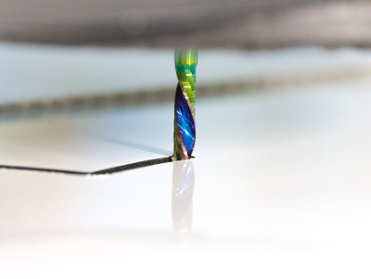 Atlas Tools Compression Spiral 1F 3.175x12 (DLC Coating) ULTRACLEAN for ACM and ACP view closeup of flutes cutting in action