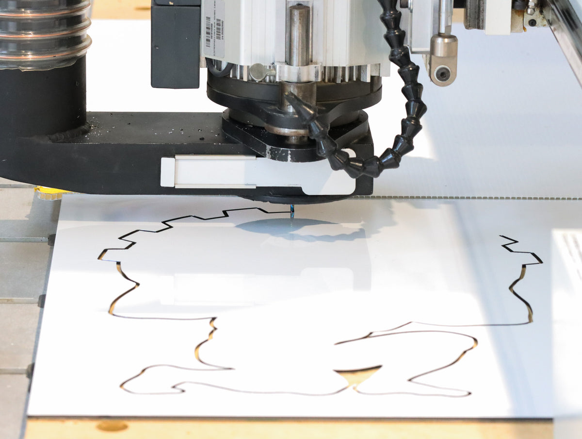 
Atlas Tools Compression Spiral 1F 3.175x12 (DLC Coating) ULTRACLEAN for ACM and ACP action shot cutting shape from material viewed from distance
