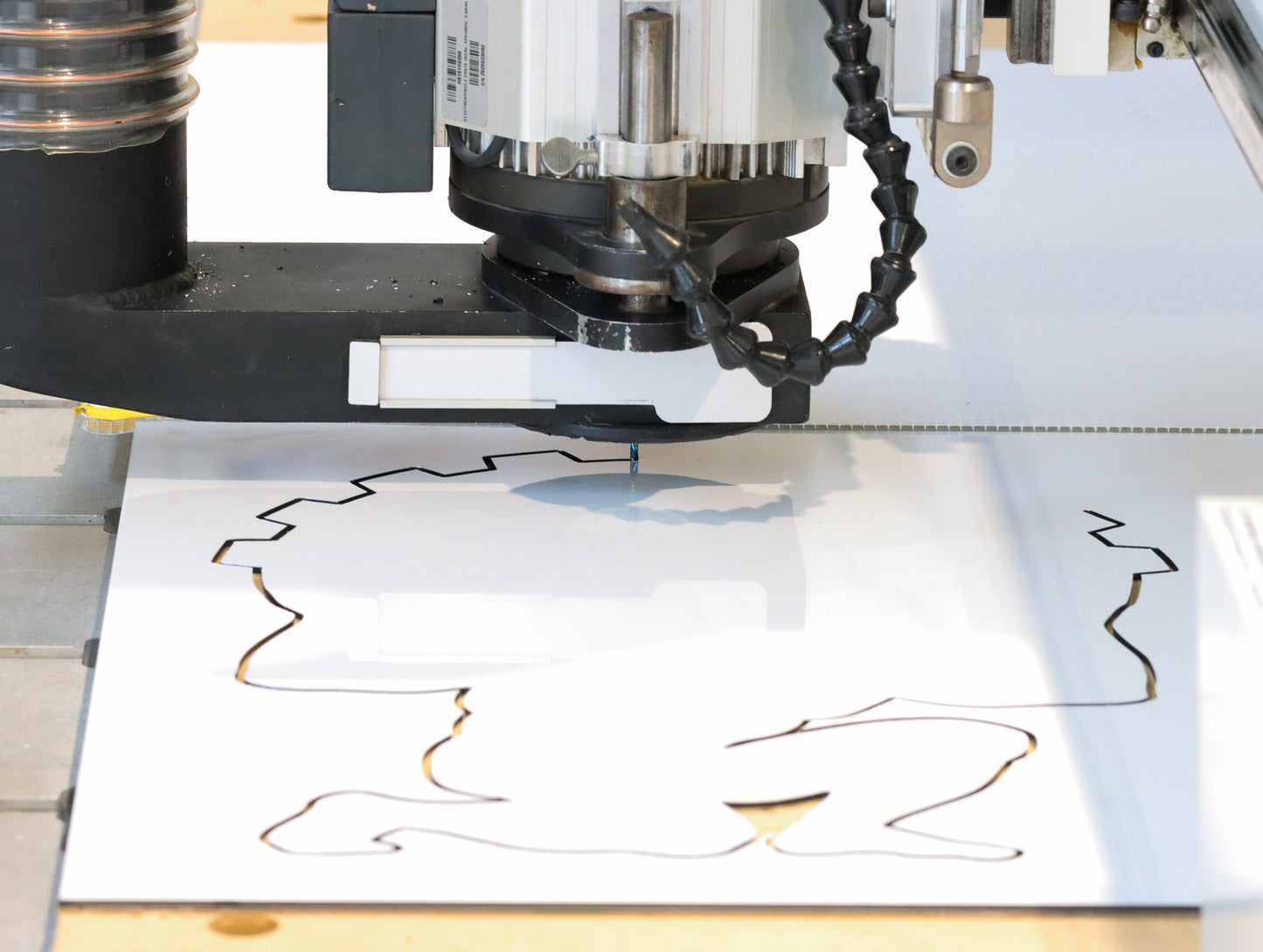 
Atlas Tools Compression Spiral 1F 3.175x12 (DLC Coating) ULTRACLEAN for ACM and ACP action shot cutting shape from material viewed from distance