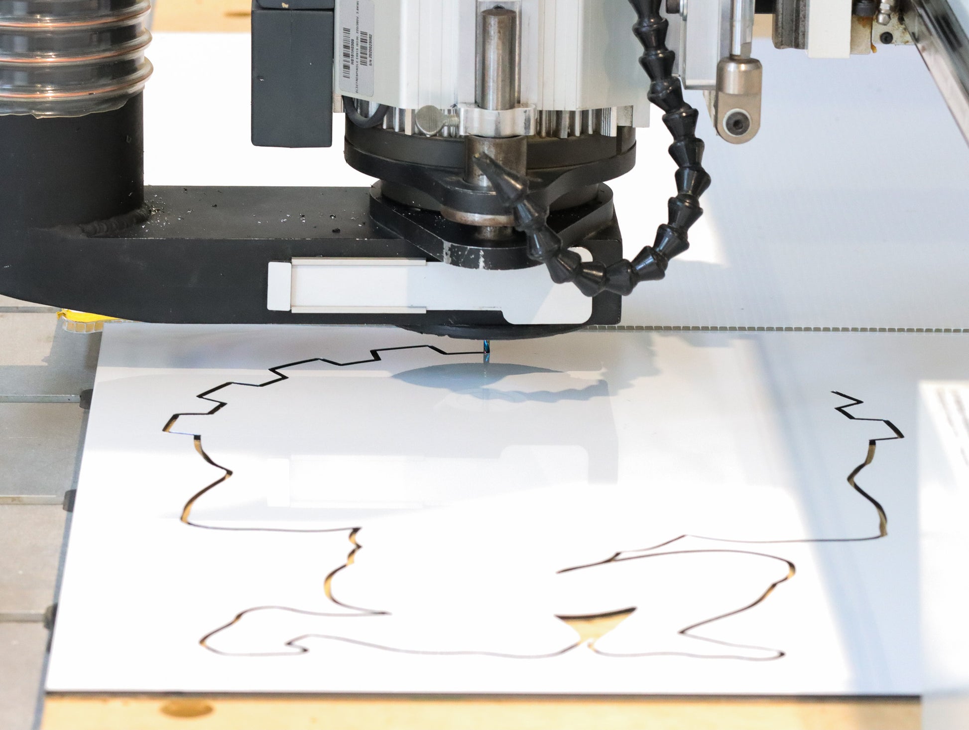 
Atlas Tools Compression Spiral 1F 3.175x12 (DLC Coating) ULTRACLEAN for ACM and ACP action shot cutting shape from material viewed from distance